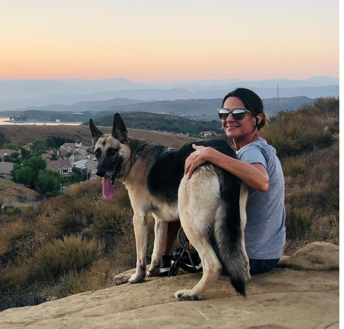 Liana McCoy with her dog on a Simi Valley trail at sunset